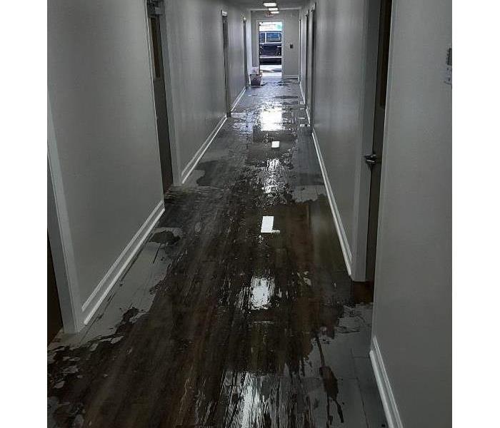 Flooded classroom hallway.